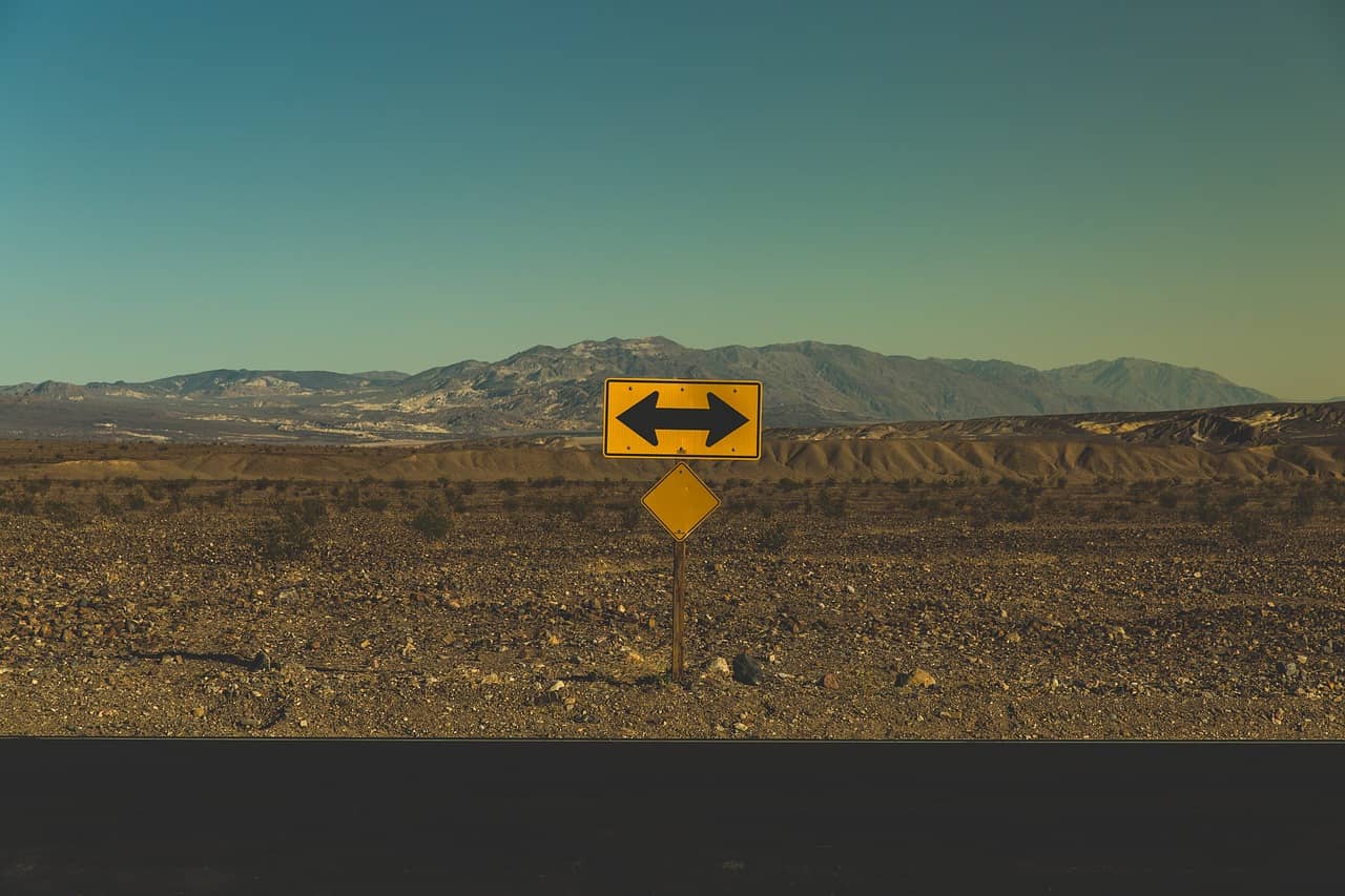 Arrows on a dusty road